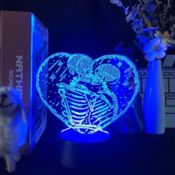 Lampe tête de mort tête squelette qui s'embarasse