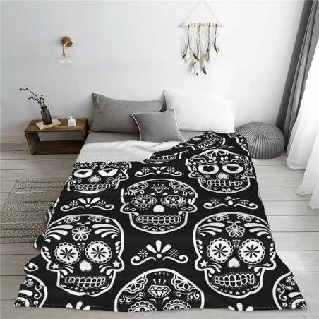 Plaid tête de mort crâne noir Santa Muerteen flanelle sur lit