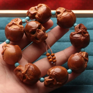 Bracelet Tête de Mort Sculptée - Crânes Roses Dominants  Artisanat Indonésien Fait Main