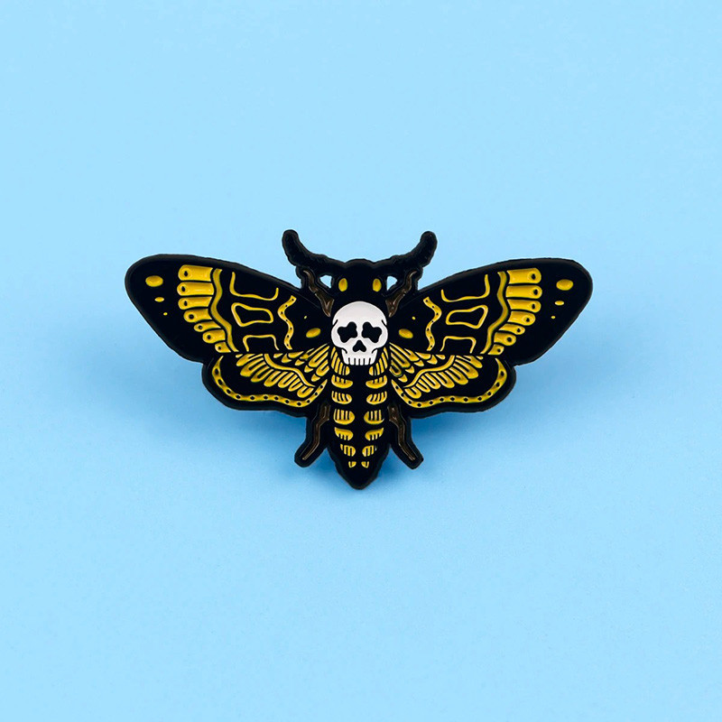 Avant Écusson Tête de Mort Papillon Poison Doré