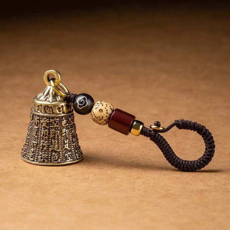 Magnifique détails du produit Porte-clé Cloche Tibétaine “Mantra des Âmes Perdues"